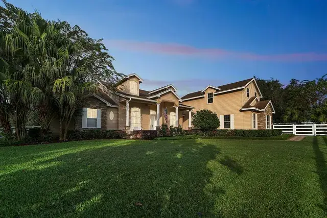 Apopka home with warm virtual twilight glow